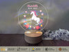 a personalized glass ornament with a unicorn on it