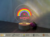 a personalized light up with a rainbow and name