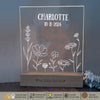 a glass plaque with a picture of flowers on it