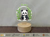 a glass globe with a picture of a panda bear