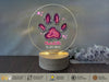 a personalized pet memorial ornament with a dog's paw