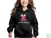 a young girl wearing a black hoodie with the words is for xena on