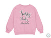 a pink sweatshirt with the words sassy pants on it